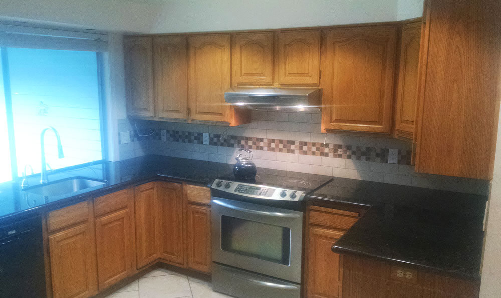 kitchen with wood cabinets Kitchen with wood cabinets, showcasing a cabinet refacing company in Portland, OR