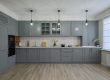 A large renovated kitchen with gray cabinetry