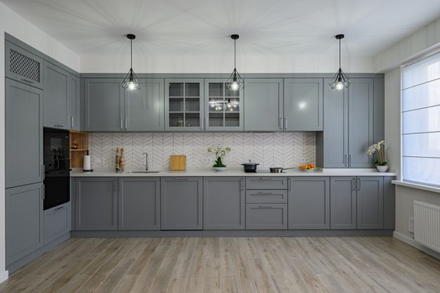 large-renovated-kitchen-with-gray-cabinetry A large renovated kitchen with gray cabinetry