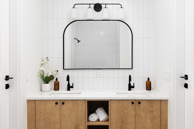vanity-and-mirror-in-newly-upgraded-bathroom A vanity and mirror in a newly upgraded bathroom