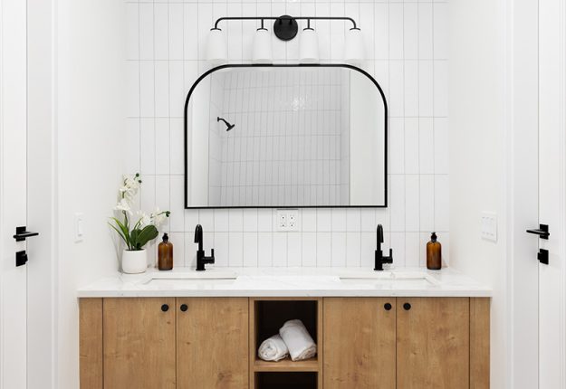 vanity-and-mirror-in-newly-upgraded-bathroom A vanity and mirror in a newly upgraded bathroom